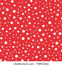 White polka dots seamless pattern on red background.