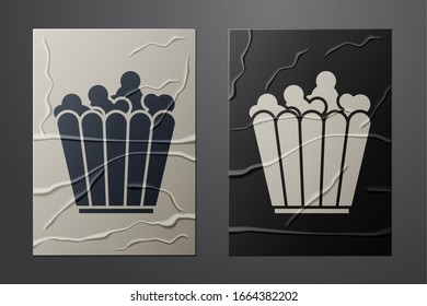 White Popcorn in cardboard box icon isolated on crumpled paper background. Popcorn bucket box. Paper art style. Vector Illustration