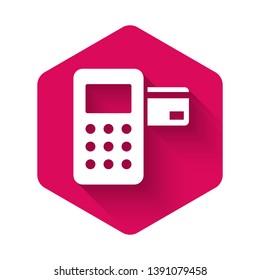 White Pos terminal with inserted credit card icon isolated with long shadow. Payment terminal transaction. Pink hexagon button. Vector Illustration