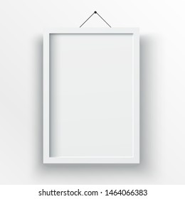 White poster with black frame mockup on grey wall