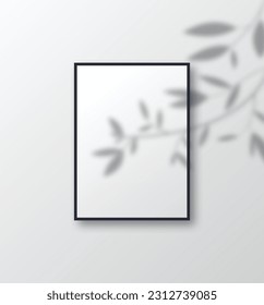 White poster with black frame with  transparent tree branch shadow overlay. Wall art poster mockup with light of branch. 