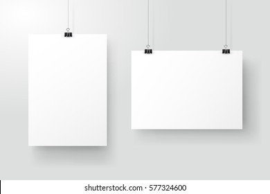 White posters hanging on binder. Grey wall with mock up empty paper blank. Layout mockup. Vertical and horizontal template sheet. 