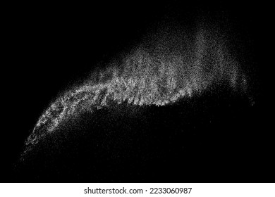 White powder explosion on black background creating abstract dust particle motion with dynamic movement and dispersion effect in freeze splash