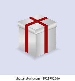 White present box with red knot isolated on white