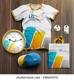 White promotional souvenirs design for corporate identity with blue and yellow geometric elements. Stationery set