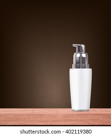 white push down bottle on wood table
