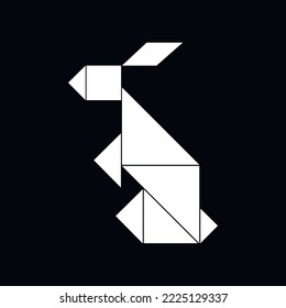 White rabbit or hare from geometry shapes on a black background. Tangram icon. Year of the Rabbit. 2023 concept.