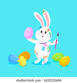 White rabbit painting Easter eggs. Cute bunny. Cartoon character design,  vector illustration isolated on blue background.