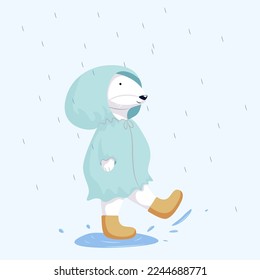 A white rabbit is playing outside in the rain, dressed in a raincoat. and in boots. Vector illustration with cartoon rabbit character. Isolated on blue background.