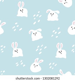 The white rabbit is sitting. On a blue background. Seamless pattern