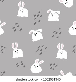 The white rabbit is sitting. On a gray background. Seamless pattern