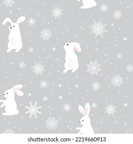 A white rabbit with snowflakes on a gray background. The symbol of the Chinese New Year. Wrapping paper, winter greetings, web page background, Christmas and New Year greeting cards