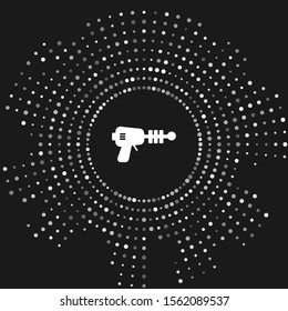 White Ray gun icon isolated on grey background. Laser weapon. Space blaster. Abstract circle random dots. Vector Illustration