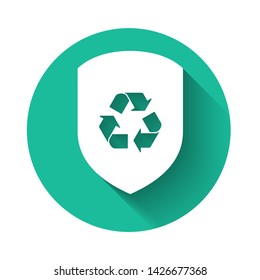White Recycle symbol inside shield icon isolated with long shadow. Eco protection sign. Green circle button. Vector Illustration