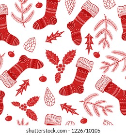 White and red Christmas socks and winter flowers and plants on a white background. Seamless vector pattern