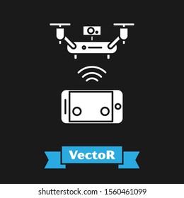 White Remote aerial drone with a camera taking photography or video recording icon isolated on black background.  Vector Illustration