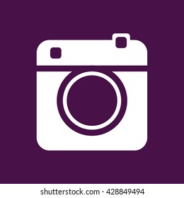 White retro camera icon vector illustration. Purple background
