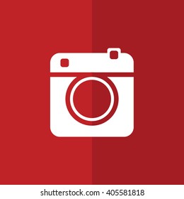 White retro camera vector illustration. Red background