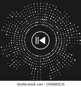 White Rewind icon isolated on grey background. Abstract circle random dots. Vector Illustration