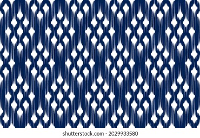 white rhombus ikat ethnic blue design background. Seamless geometric ikat pattern in tribal, folk embroidery abstract art. ornament print. Design for carpet, clothing, wrapping, fabric, fashion.