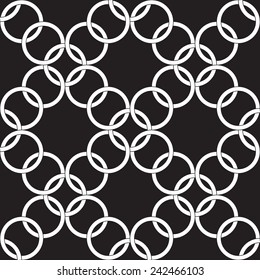 White rings on a black background.