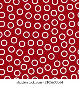 White rings seamless pattern with red background.