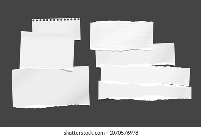 White ripped blank horizontal note paper strips for text or message stuck on black background