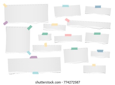 White ripped blank, lined note, notebook paper strips for text or message stuck with colorful adhesive, sticky tape on white background.