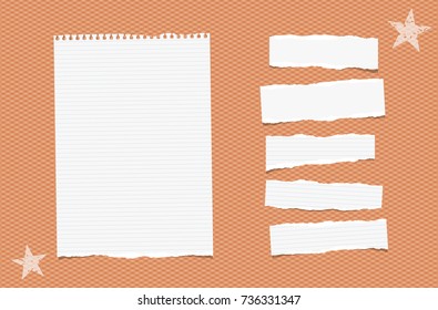 White ripped lined paper strips, sheet, notebook, note for text or message stuck tape on orange squared background.