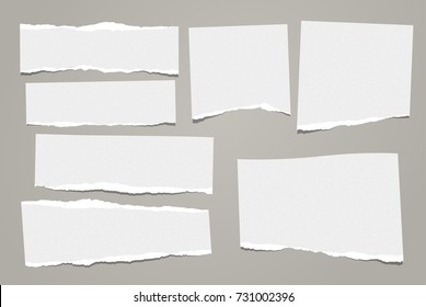 White ripped note, notebook paper stuck with sticky tape on black background. - Shutterstock ID 731002396