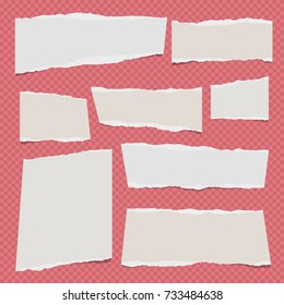 White ripped note, notebook paper for message or text stuck on red squared background.