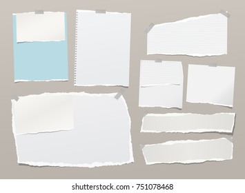 White ripped notebook paper sheets, note for text or message stuck with sticky tape