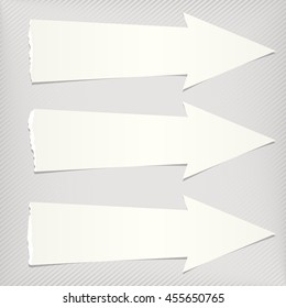 White ripped paper arrows with shadow are on gray diagonal background