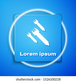 White Rocket icon isolated on blue background. Blue square button. Vector Illustration