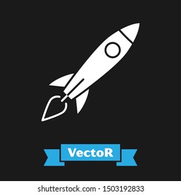 White Rocket ship with fire icon isolated on black background. Space travel.  Vector Illustration