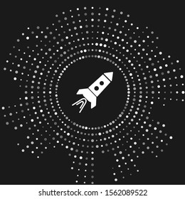 White Rocket ship with fire icon isolated on grey background. Space travel. Abstract circle random dots. Vector Illustration