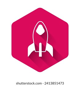 White Rocket ship icon isolated with long shadow background. Space travel. Pink hexagon button. Vector
