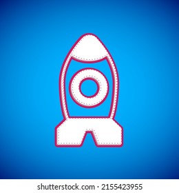 White Rocket ship toy icon isolated on blue background. Space travel.  Vector