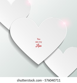  White romantic background with white paper cut out hearts and greeting inscription with Happy Valentine's Day. Holiday card with glare. International holiday of lovers. Festive banner or poster.
