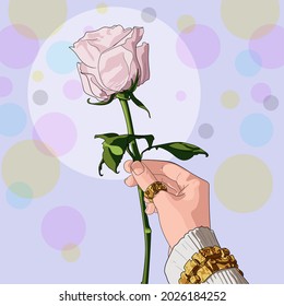 a white rose in a woman's hand with a ring and a bracelet