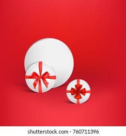 White round box tied with a red shiny ribbon bow. Design element for Christmas, birthday, anniversary, new year, party or other celebrations and events.