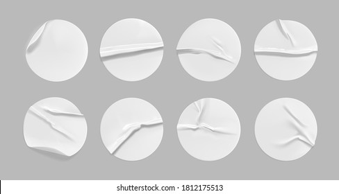 White round crumpled sticker mock up set. Adhesive white paper or plastic sticker label with glued, wrinkled effect on gray background. Blank templates of a label or price tags. 3d realistic vector