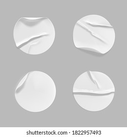 White round crumpled sticker mock up set. Adhesive clear white paper or plastic sticker label with glued, wrinkled effect on gray background. Blank templates label or price tags. 3d realistic vector
