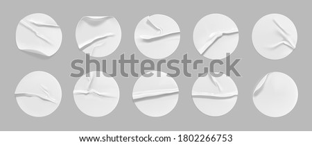 White round crumpled sticker mock up set. Adhesive white paper or plastic sticker label with glued, wrinkled effect on gray background. Blank templates of a label or price tags. 3d realistic vector