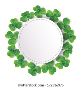 White round label decorated with fresh green leaves on white background.