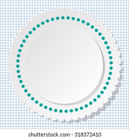 White round label with dots on a checkered paper background.