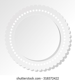 White round label with dots on a white background.