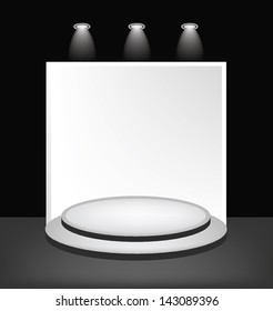 White round podium on the black background.