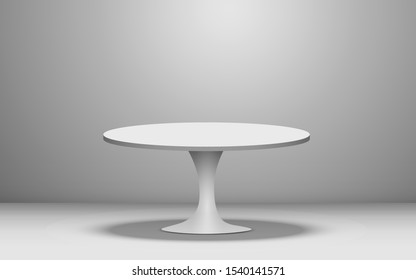 white round table in the white studio room