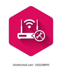 White Router wi-fi with screwdriver and wrench icon isolated with long shadow. Adjusting, service, setting, maintenance, repair, fixing. Pink hexagon button. Vector Illustration